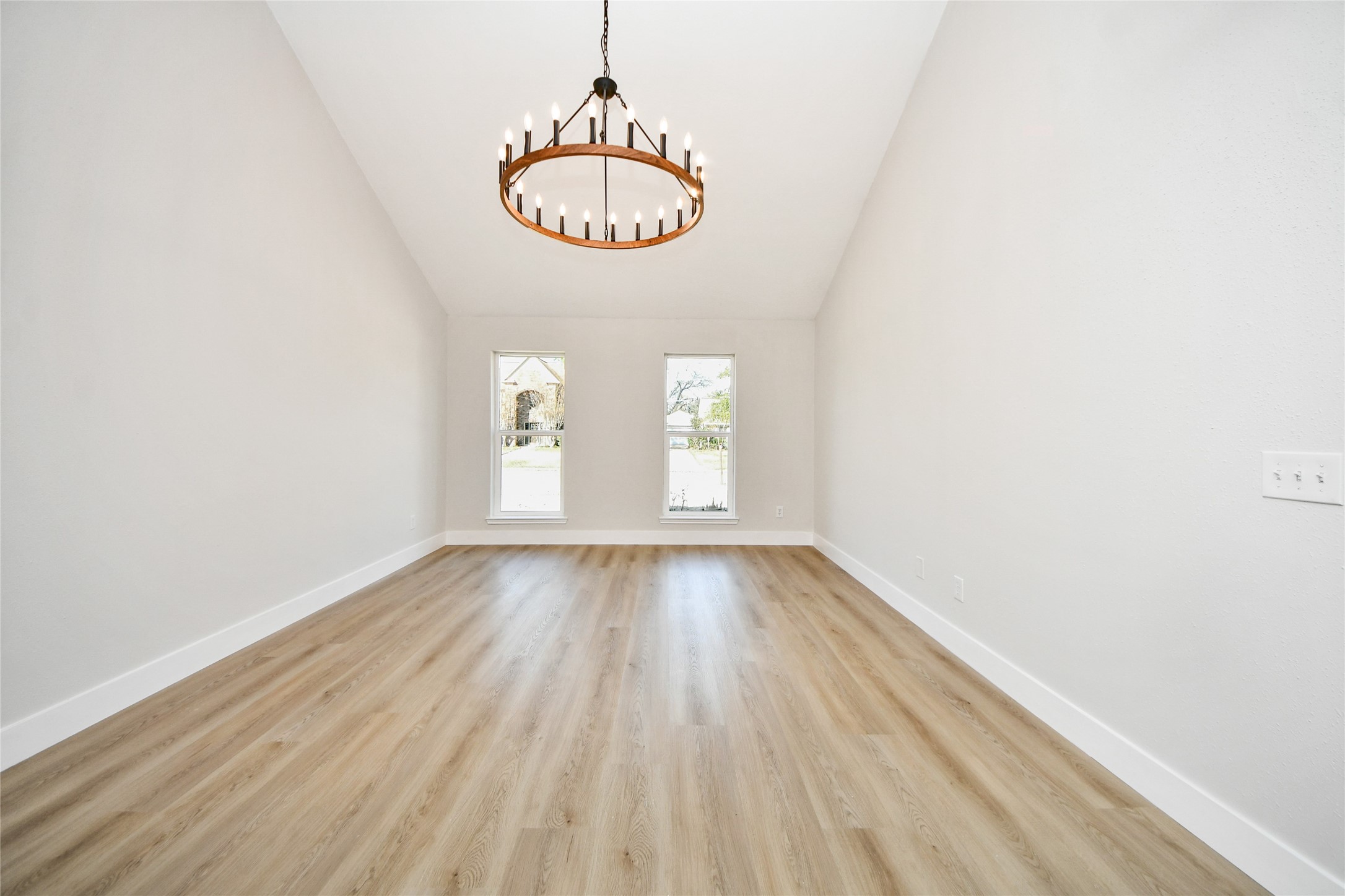 10223 Dude Road Houston, TX 77064 - Photo 24 of 44 a view of an empty room with window and wooden floor