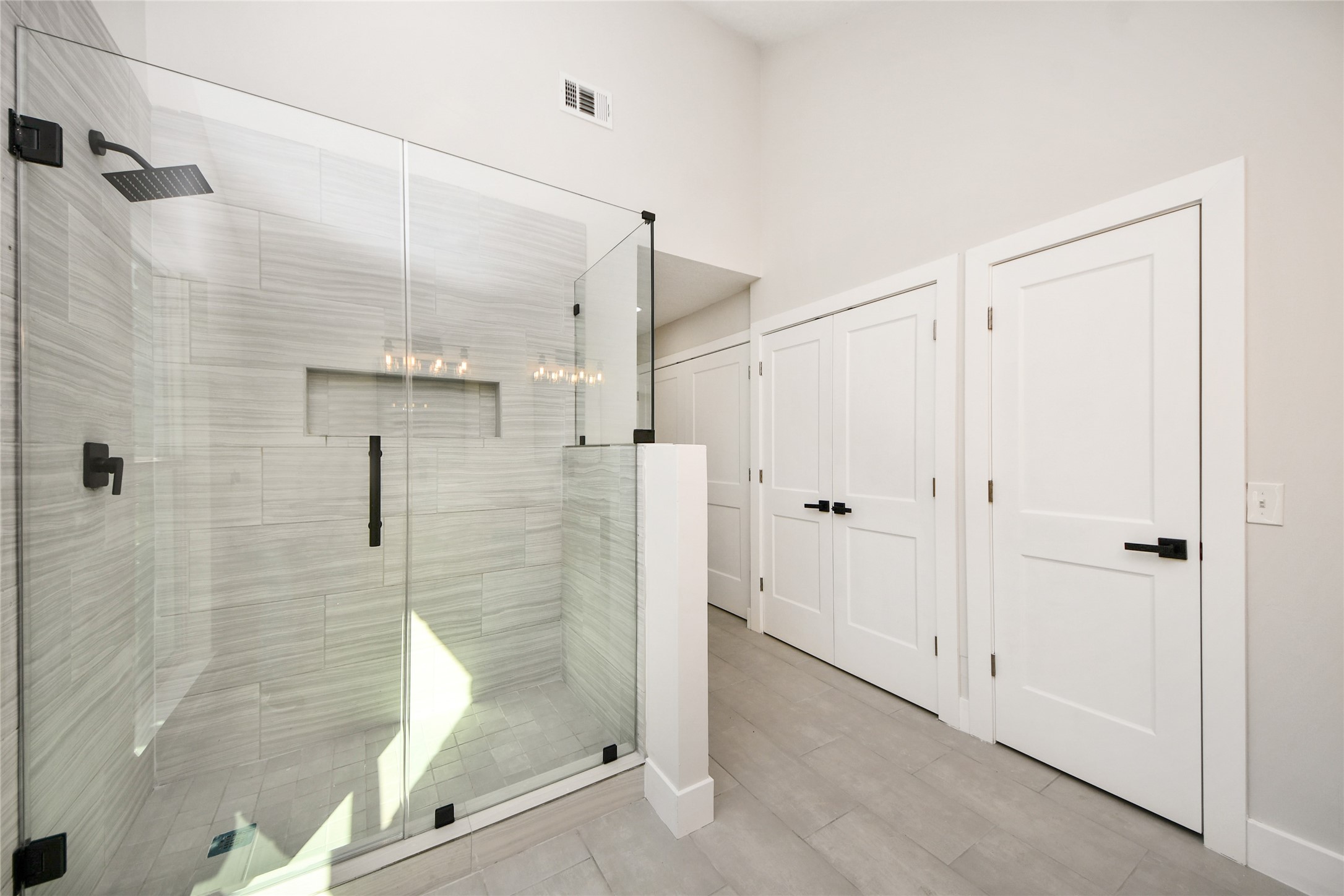 10223 Dude Road Houston, TX 77064 - Photo 26 of 44 a bathroom with a shower and a glass door