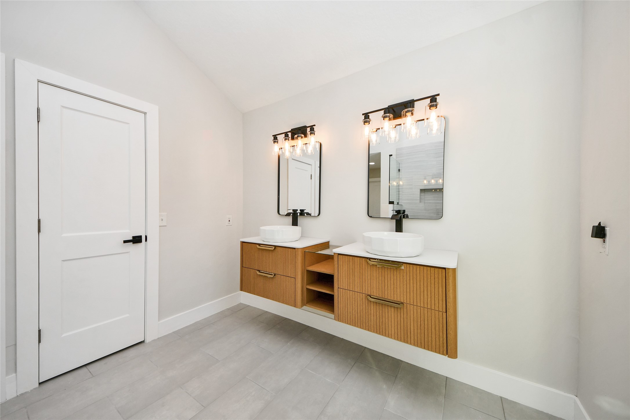 10223 Dude Road Houston, TX 77064 - Photo 27 of 44 a bathroom with a double vanity sink mirror and