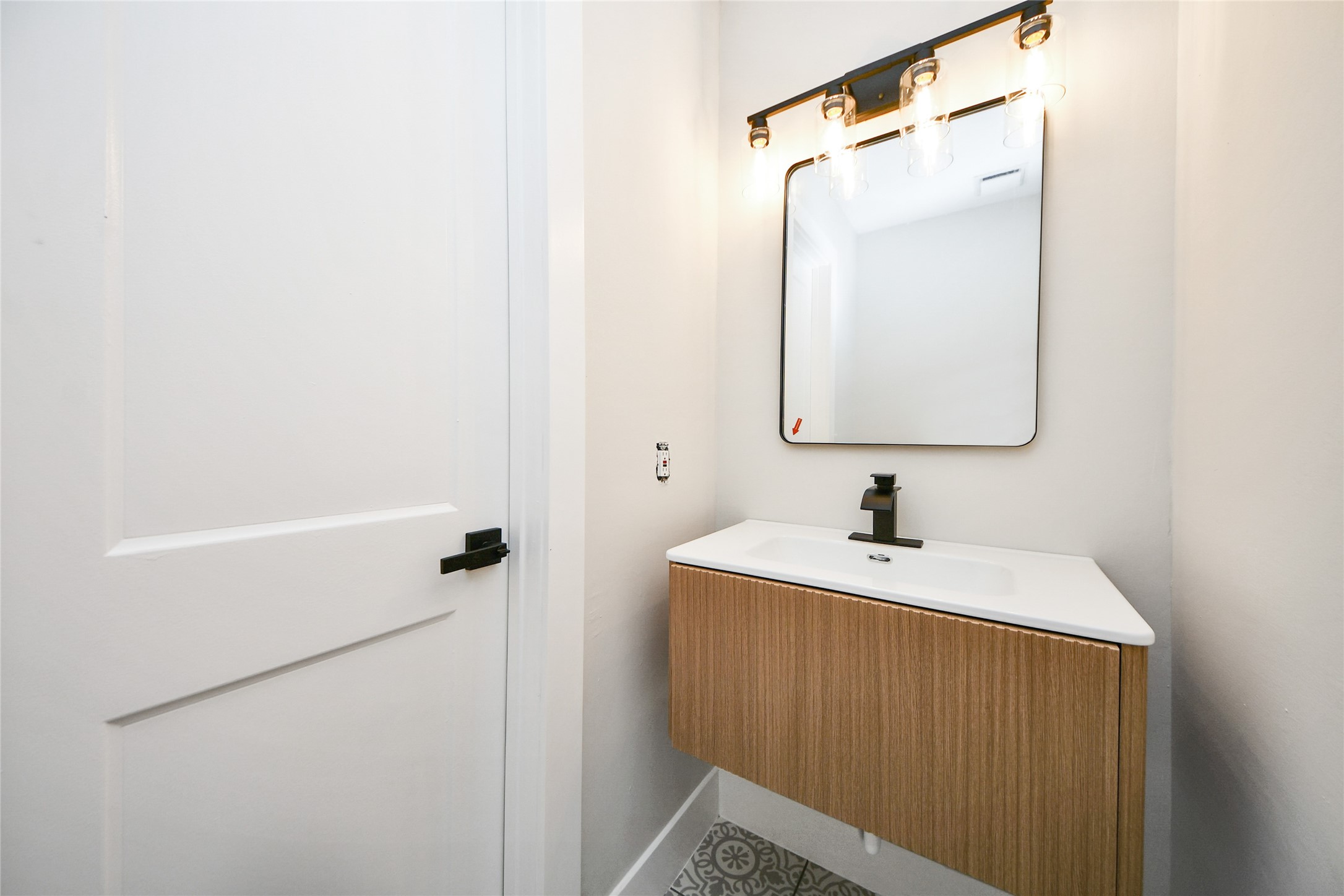 10223 Dude Road Houston, TX 77064 - Photo 38 of 44 a bathroom with a sink and a mirror