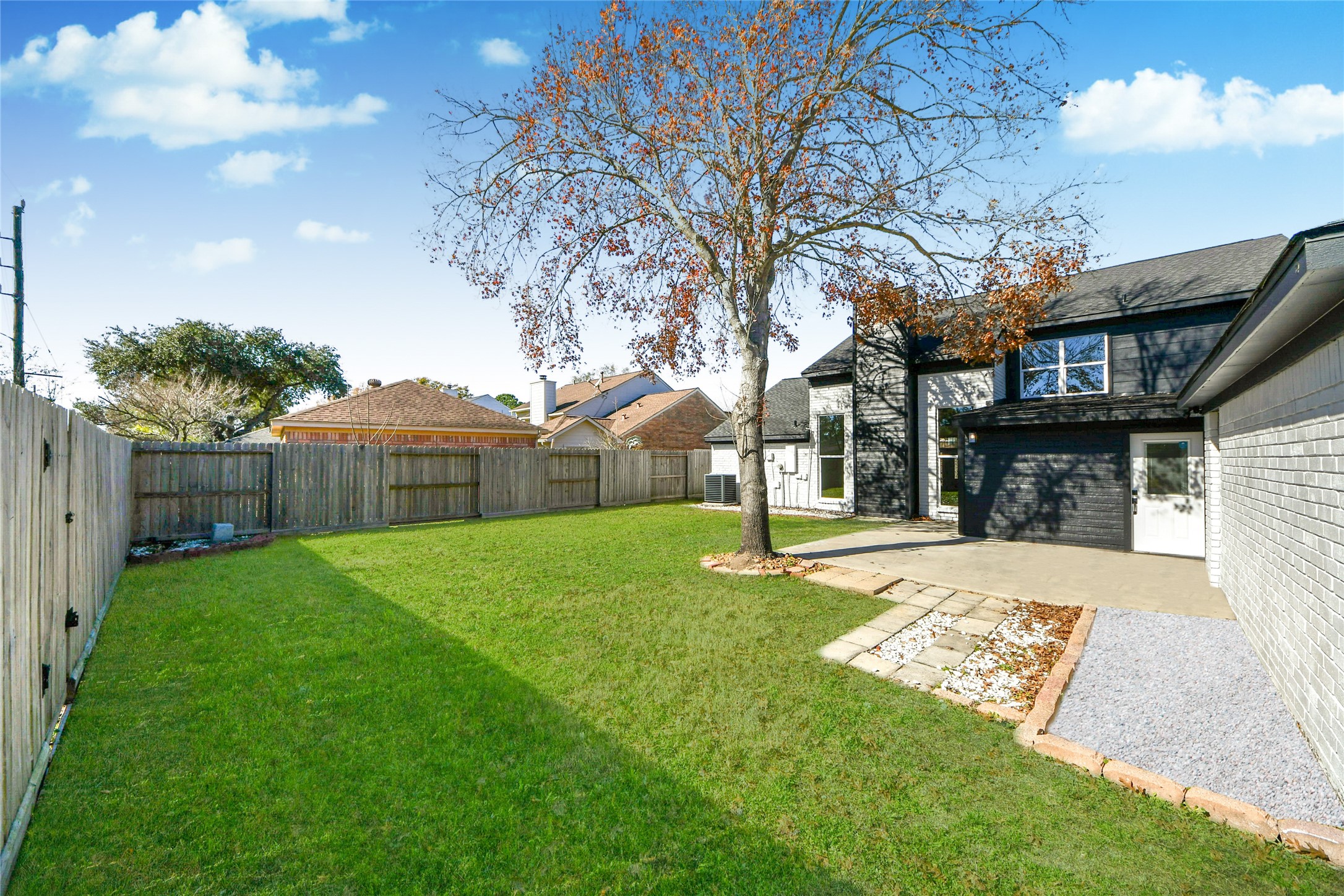 10223 Dude Road Houston, TX 77064 - Photo 40 of 44 a view of a backyard with a tree