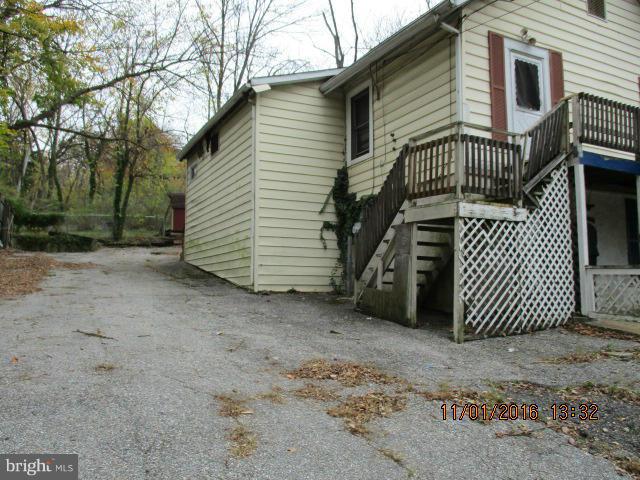 5218 Dogwood Road Gwynn Oak, MD 21207 - Photo 11 of 11 a view of a house with a yard