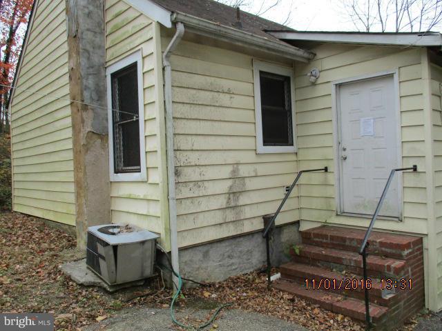 5218 Dogwood Road Gwynn Oak, MD 21207 - Photo 10 of 11 a front view of a house with outdoor seating