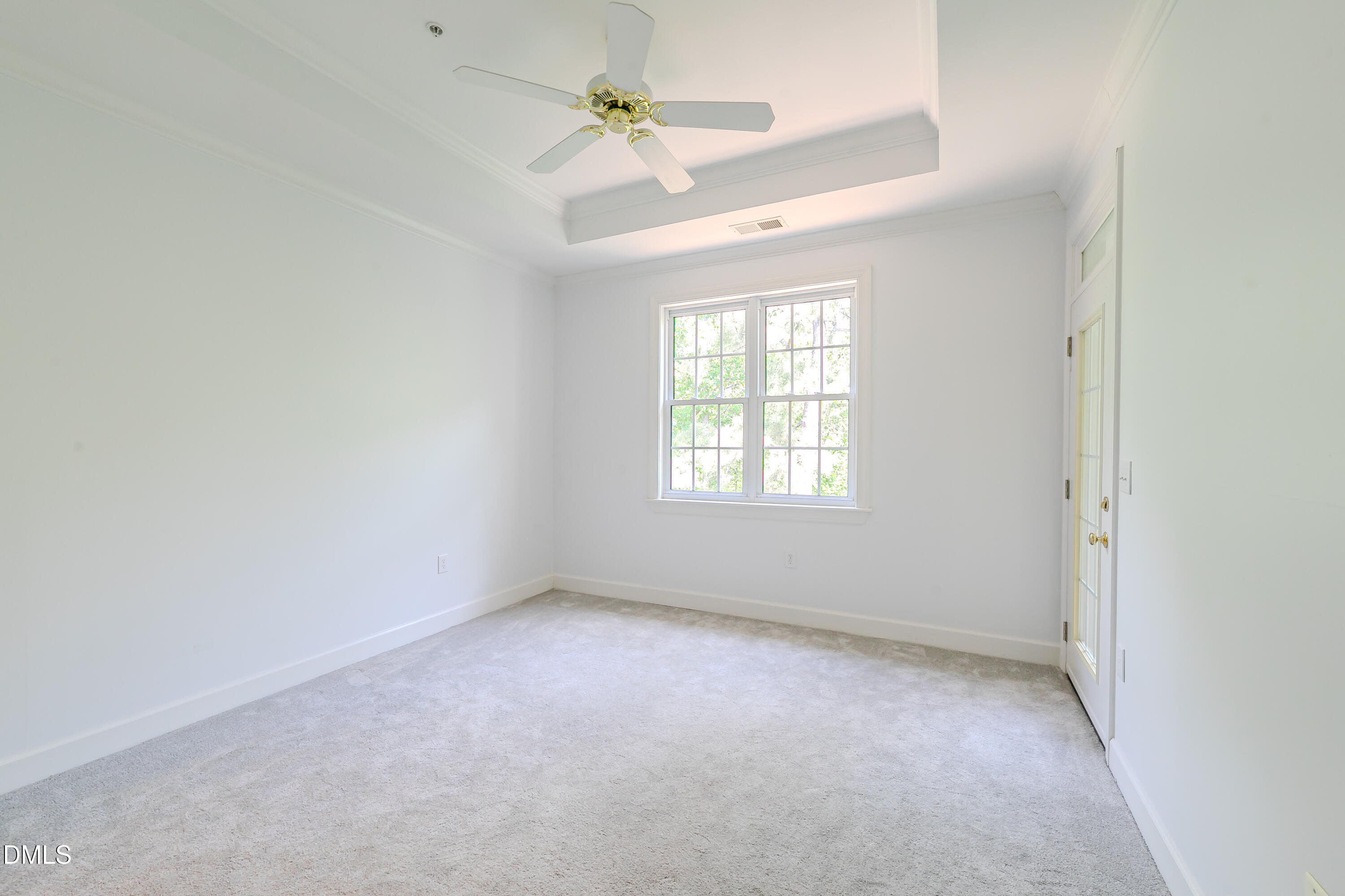 116 Northbrook Drive, Unit 305 Raleigh, NC 27609 - Photo 10 of 43 an empty room with a window and a fan