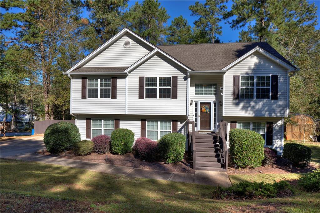 45 Sleepy Hollow Road Powder Springs, GA 30127 - Photo 1 of 1 a front view of a house with garden