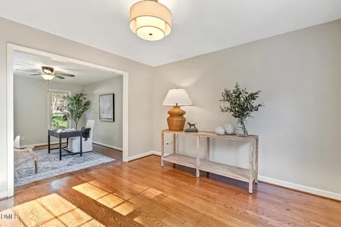 a view of a yard with wooden fence