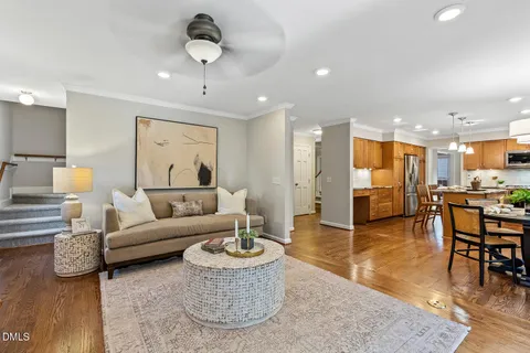 a kitchen with stainless steel appliances granite countertop a stove and a wooden floors