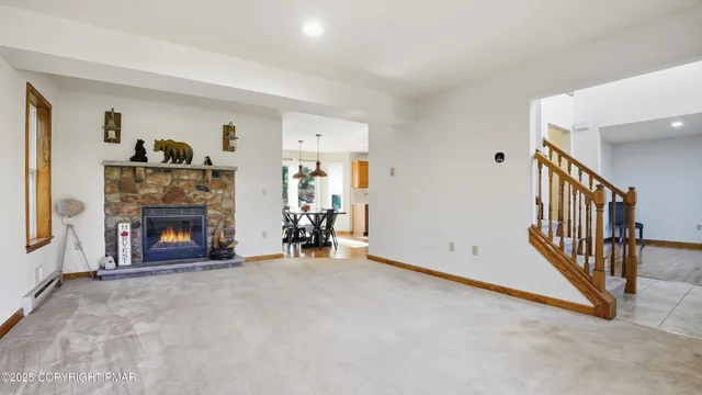 a dining room with furniture and window