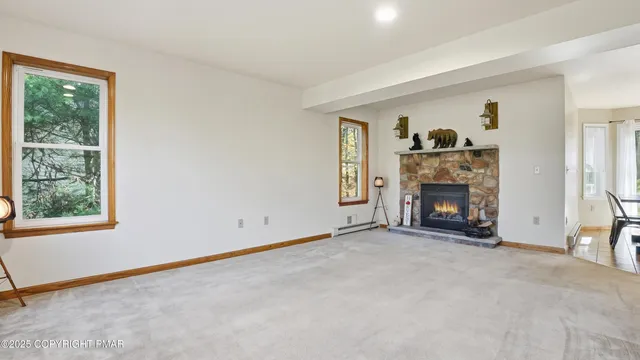 a kitchen with a dining table chairs and refrigerator