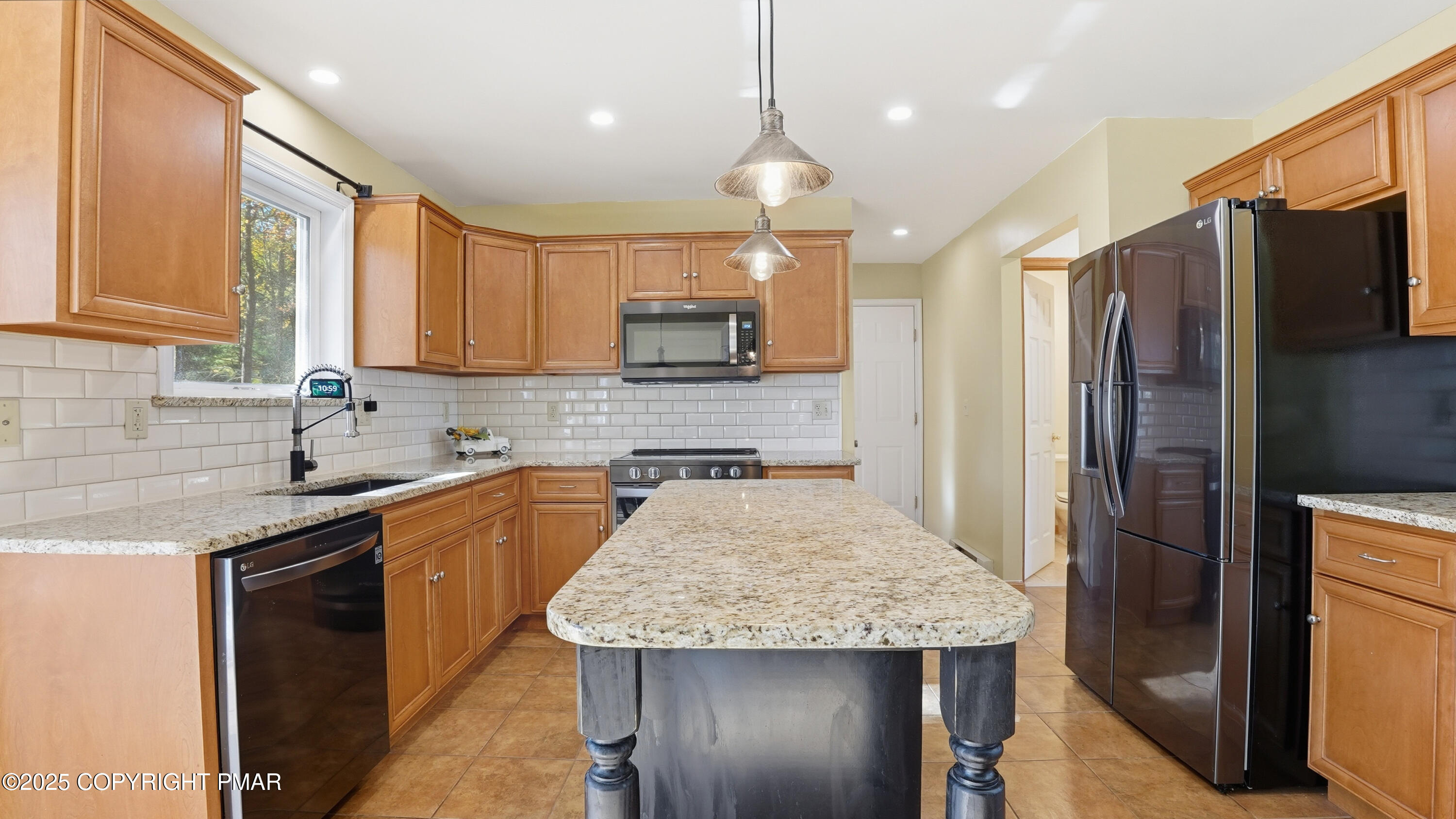 104 Wolf Hollow Road Lake Harmony, PA 18624 - Photo 23 of 101 a kitchen with stainless steel appliances granite countertop a sink refrigerator and cabinets
