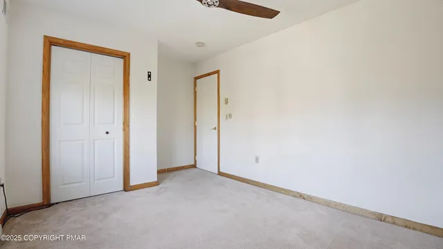 a view of a workspace with furniture and wooden floor