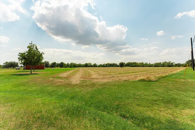 a view of a lake with a big yard