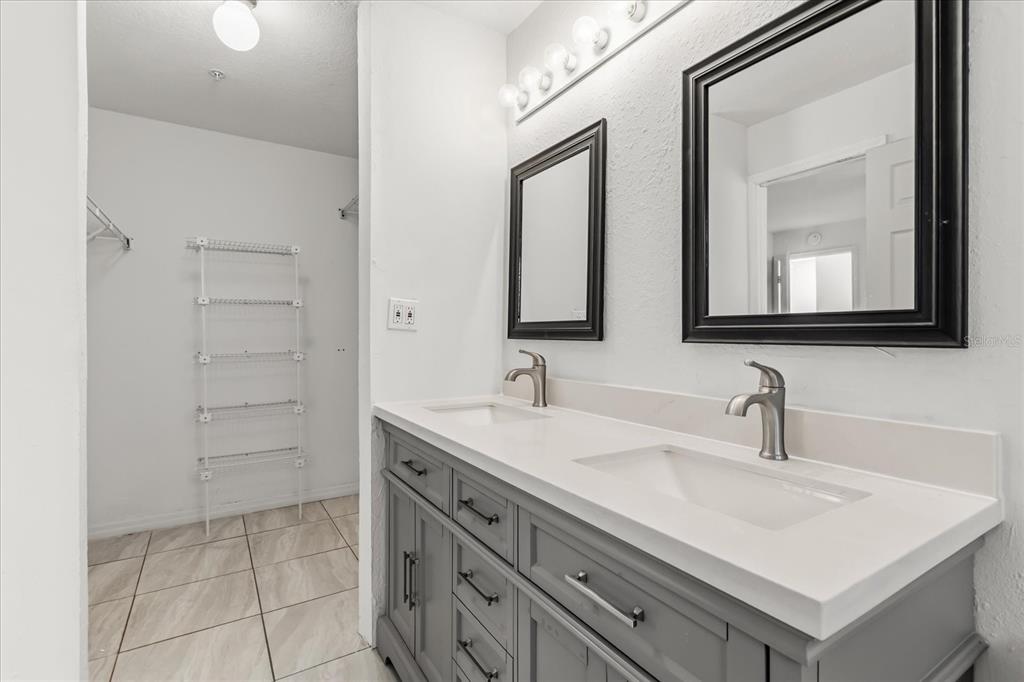 3374 Hamlet Loop Winter Park, FL 32792 - Photo 16 of 37 a bathroom with a sink and a mirror