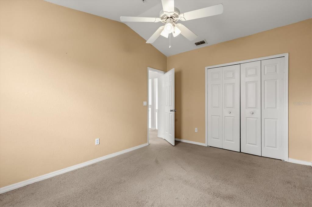 3374 Hamlet Loop Winter Park, FL 32792 - Photo 21 of 37 an empty room with a ceiling fan and a window