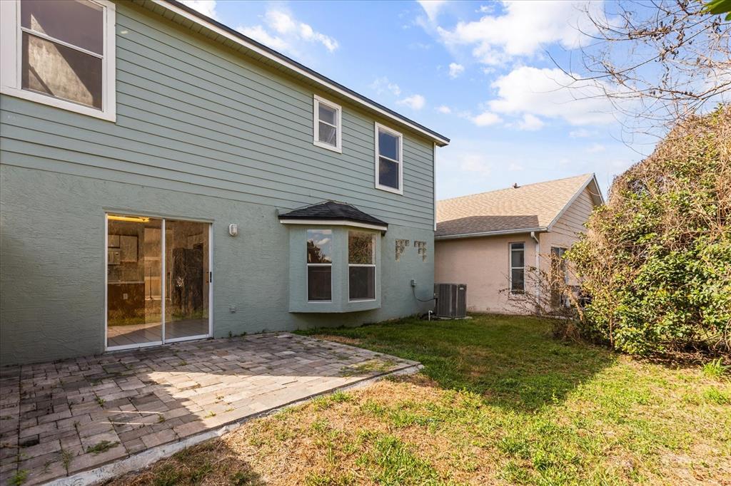 3374 Hamlet Loop Winter Park, FL 32792 - Photo 23 of 37 a front view of a house with a yard