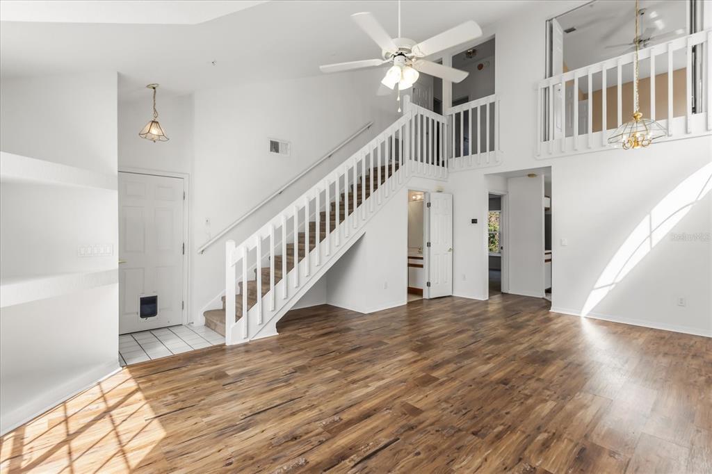 3374 Hamlet Loop Winter Park, FL 32792 - Photo 3 of 37 a view of entryway and hall with wooden floor