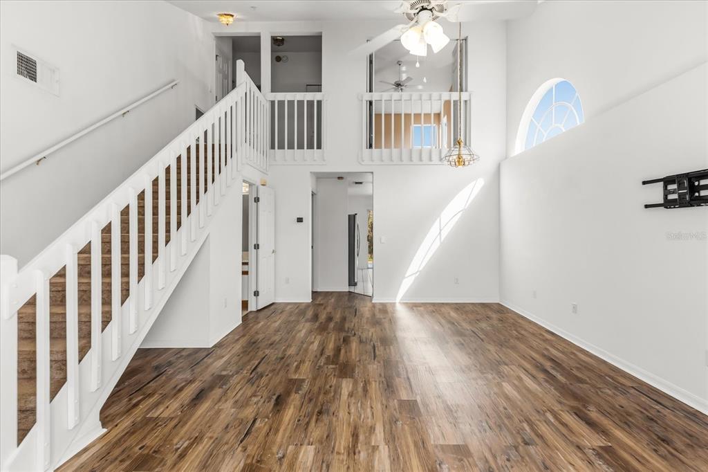 3374 Hamlet Loop Winter Park, FL 32792 - Photo 5 of 37 a view of entryway and hall with wooden floor