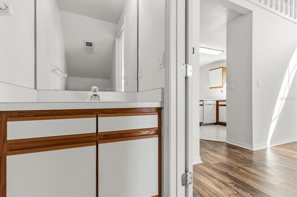 3374 Hamlet Loop Winter Park, FL 32792 - Photo 6 of 37 a bathroom with a sink and a mirror