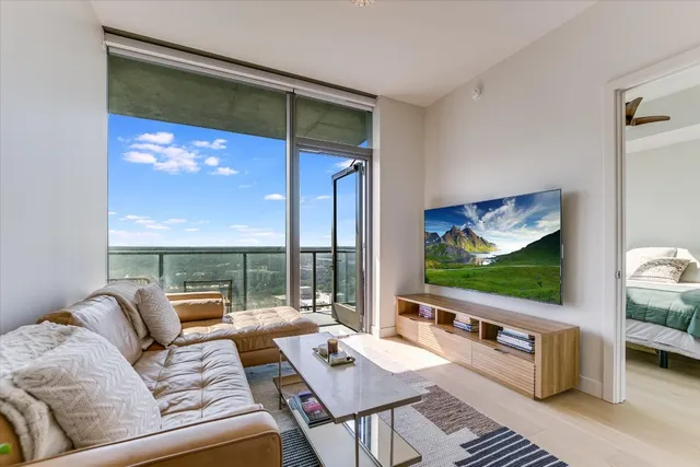 a living room with furniture and a flat screen tv