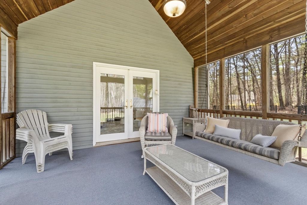 78 Cutters Ridge Road Carlisle, MA 01741 - Photo 22 of 42 a balcony with furniture and a large window