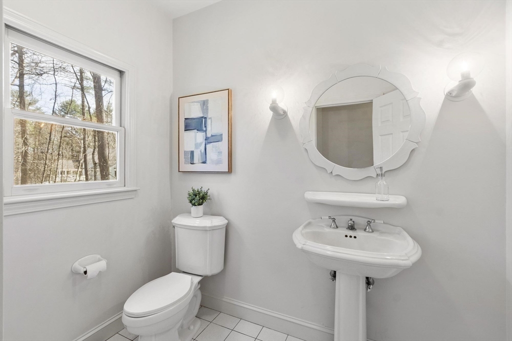 78 Cutters Ridge Road Carlisle, MA 01741 - Photo 24 of 42 a bathroom with a toilet sink and mirror