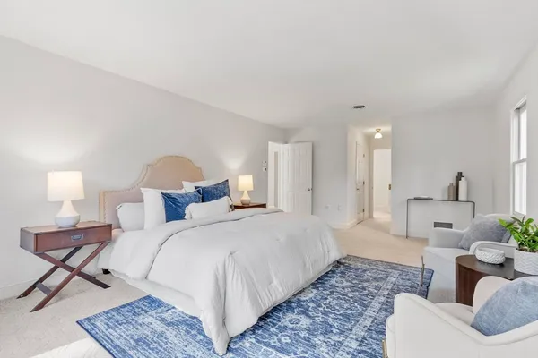 a bedroom with a bed and a couch