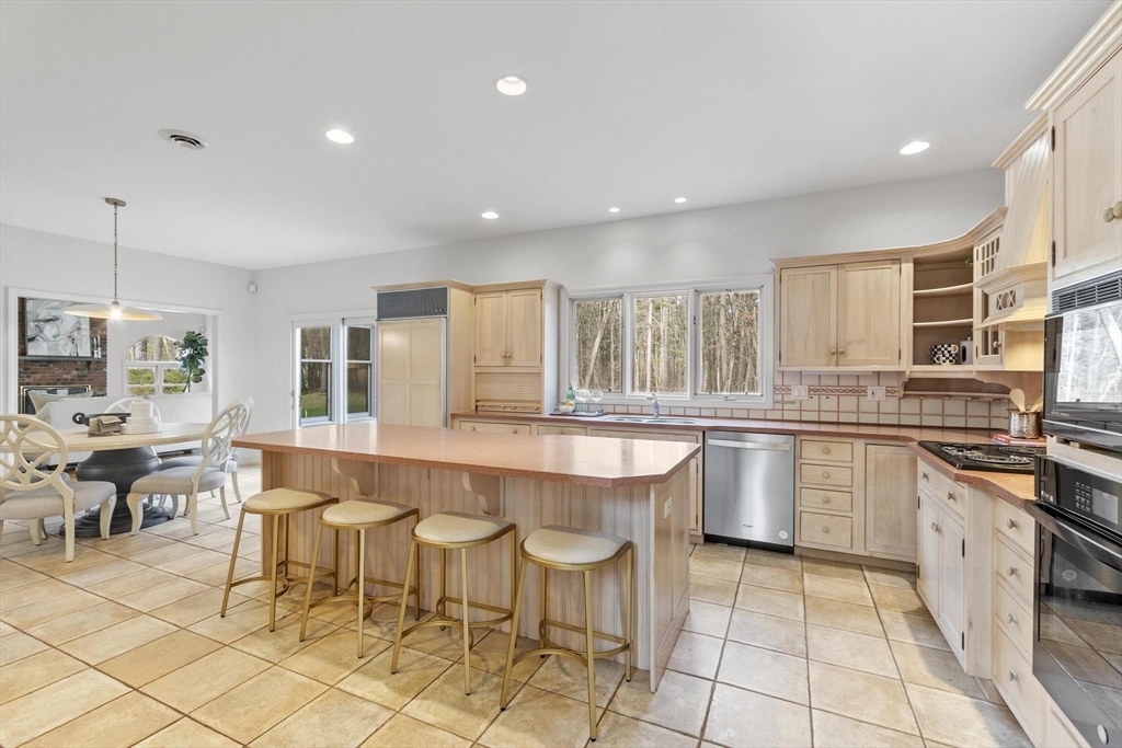 78 Cutters Ridge Road Carlisle, MA 01741 - Photo 9 of 42 a large kitchen with lots of counter and chairs