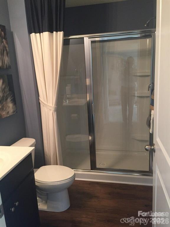 3973 BETHESDA Place Concord, NC 28025 - Photo 12 of 12 a white toilet sitting next to a shower