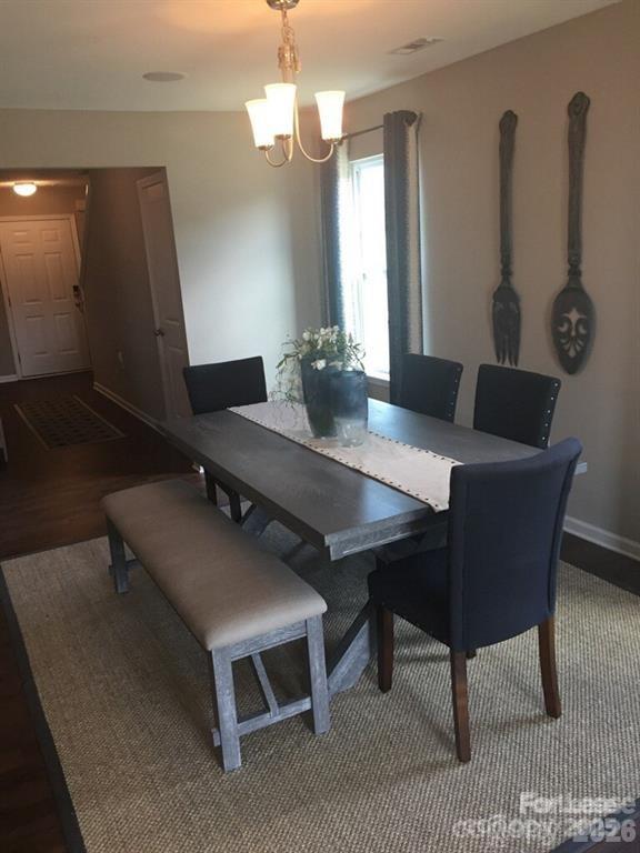 3973 BETHESDA Place Concord, NC 28025 - Photo 5 of 12 a view of a dining room with furniture