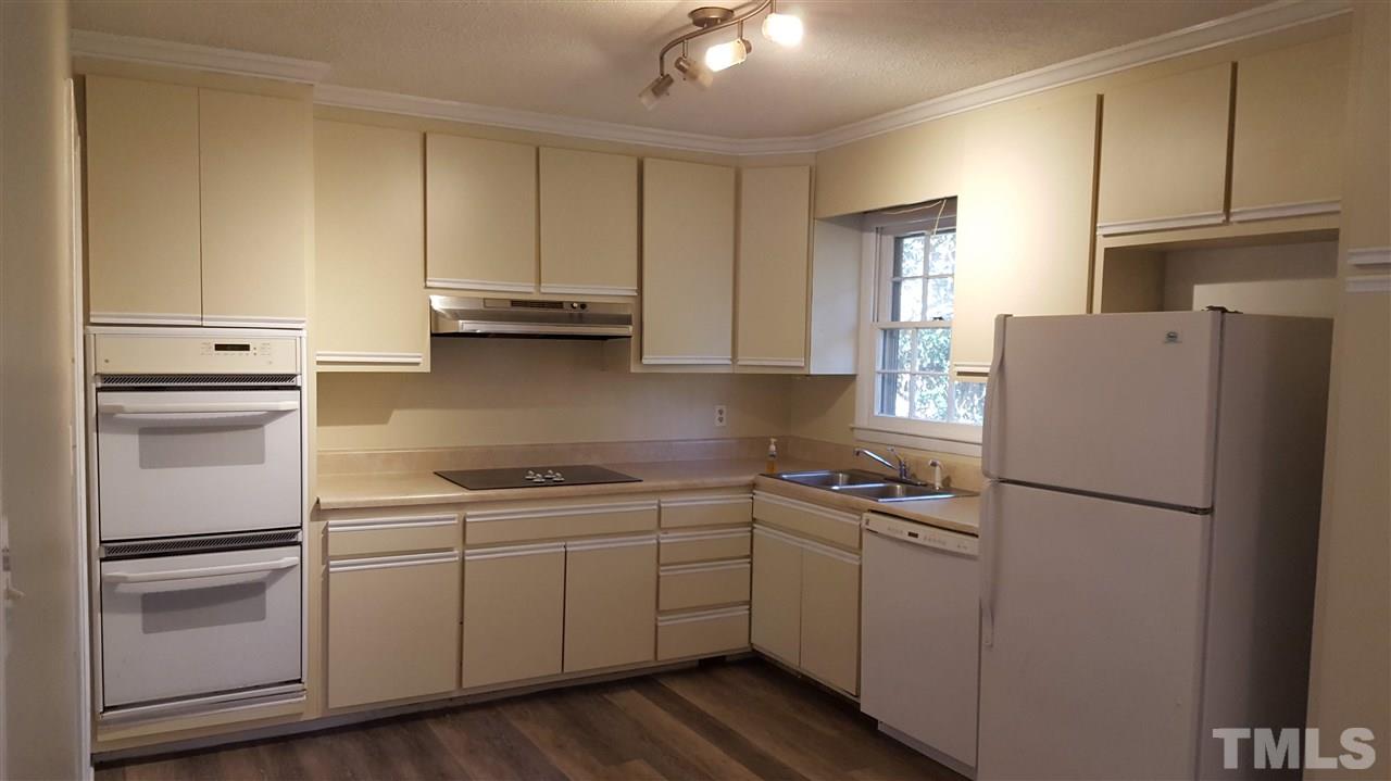 3232 Ward Road Raleigh, NC 27604 - Photo 3 of 22 a kitchen with cabinets appliances and a window