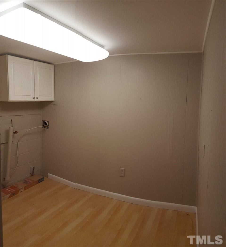 3232 Ward Road Raleigh, NC 27604 - Photo 22 of 22 a view of a room with racks on the wall