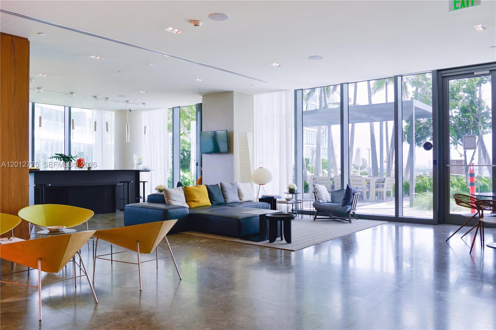 650 Northeast 32nd Street, Unit 2804 Miami, FL 33137 - Photo 30 of 48 a living room with furniture and floor to ceiling windows