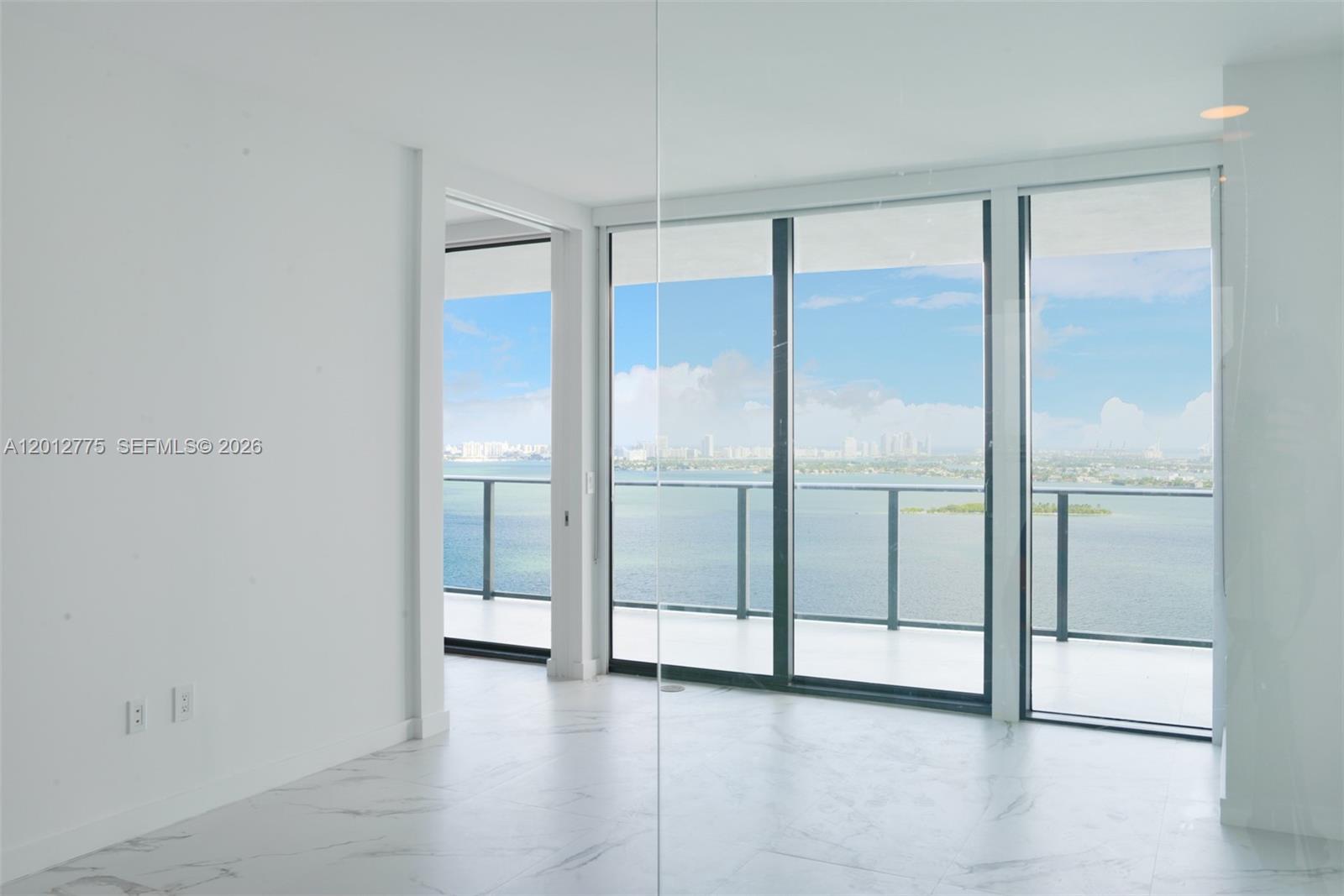 650 Northeast 32nd Street, Unit 2804 Miami, FL 33137 - Photo 3 of 48 a view of an empty room with glass door
