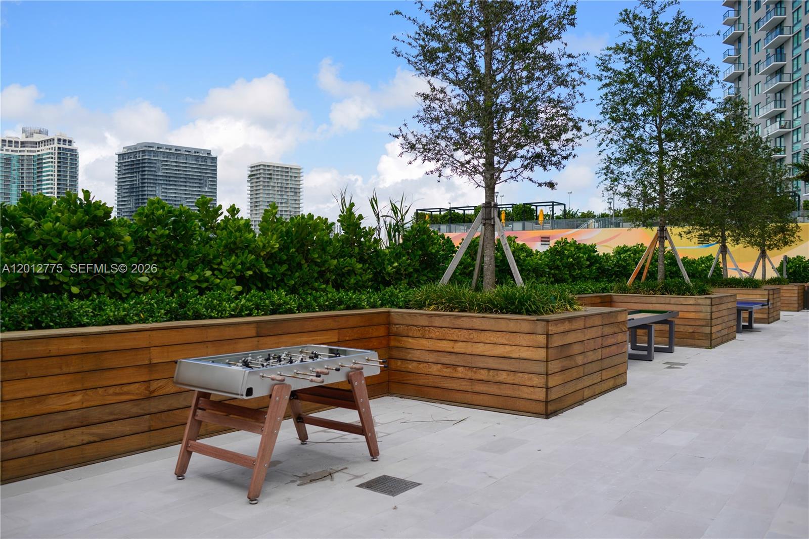650 Northeast 32nd Street, Unit 2804 Miami, FL 33137 - Photo 39 of 48 a view of outdoor sitting area with furniture and trees