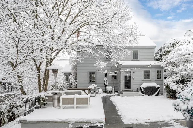 a view of a house with backyard porch and sitting area