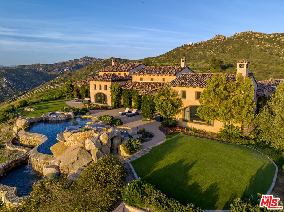18000 Sunset Point Road Poway, CA 92064 - Photo 1 of 43 a view of a swimming pool with a lake view