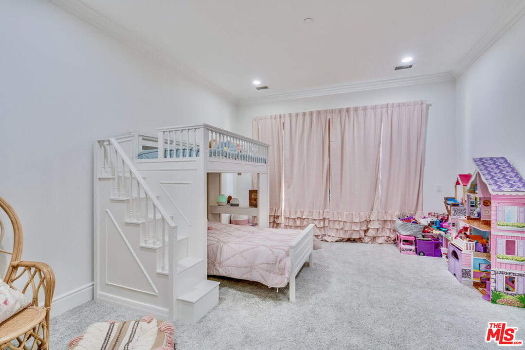 18000 Sunset Point Road Poway, CA 92064 - Photo 21 of 43 a bedroom with furniture and a chandelier