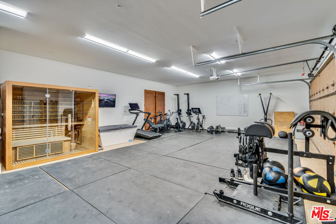 18000 Sunset Point Road Poway, CA 92064 - Photo 28 of 43 a view of a room with gym equipment