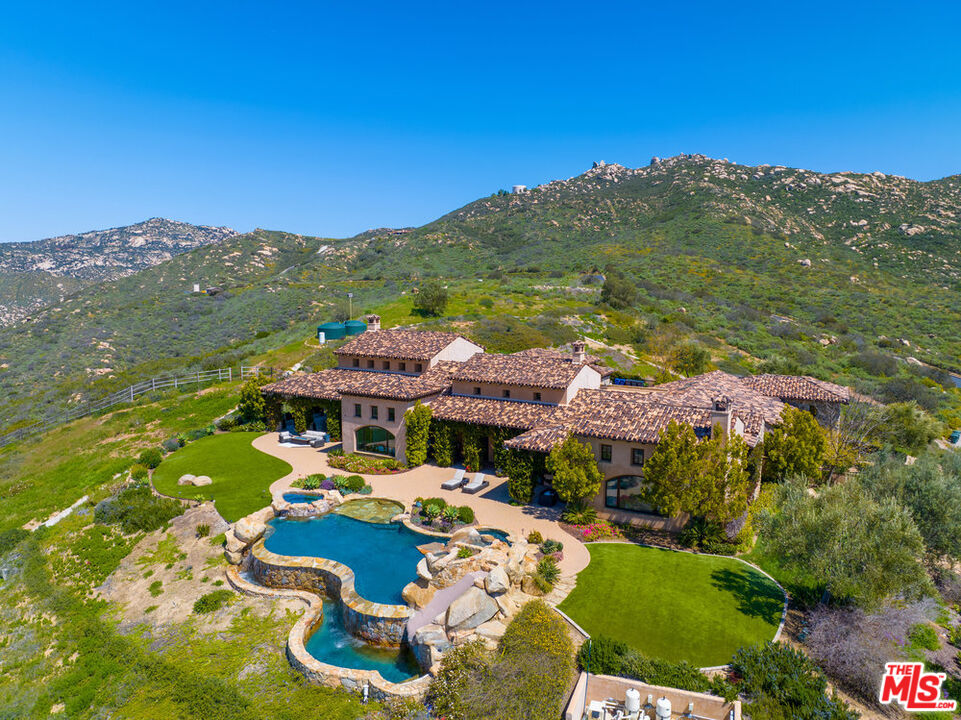 18000 Sunset Point Road Poway, CA 92064 - Photo 32 of 43 a view of a city with mountains in the background