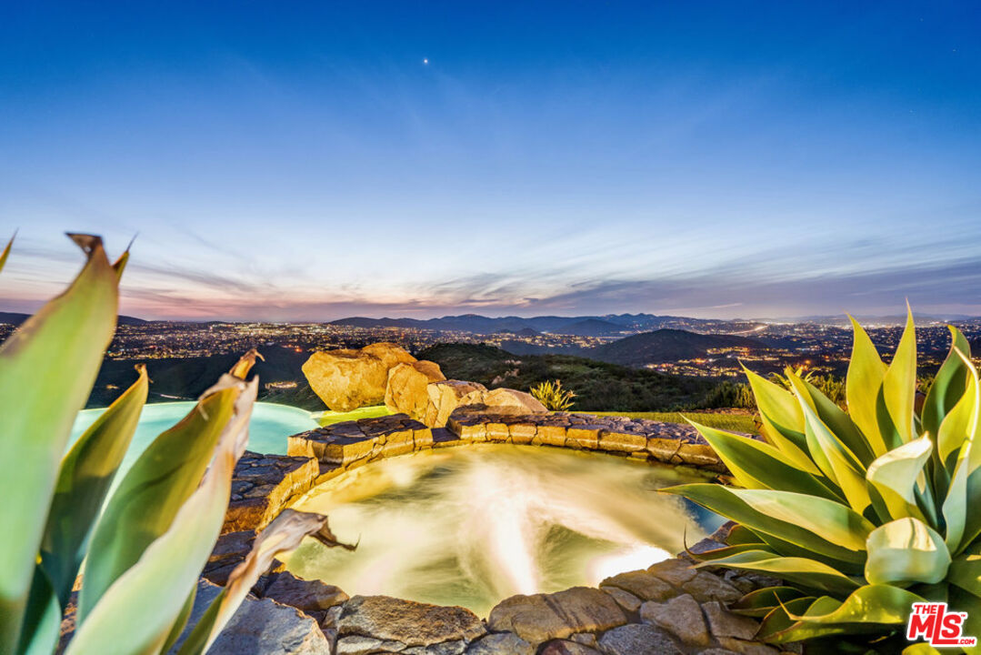 18000 Sunset Point Road Poway, CA 92064 - Photo 34 of 43 a view of a swimming pool with an outdoor seating