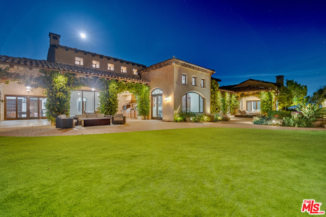 18000 Sunset Point Road Poway, CA 92064 - Photo 38 of 43 a front view of a building with a big yard
