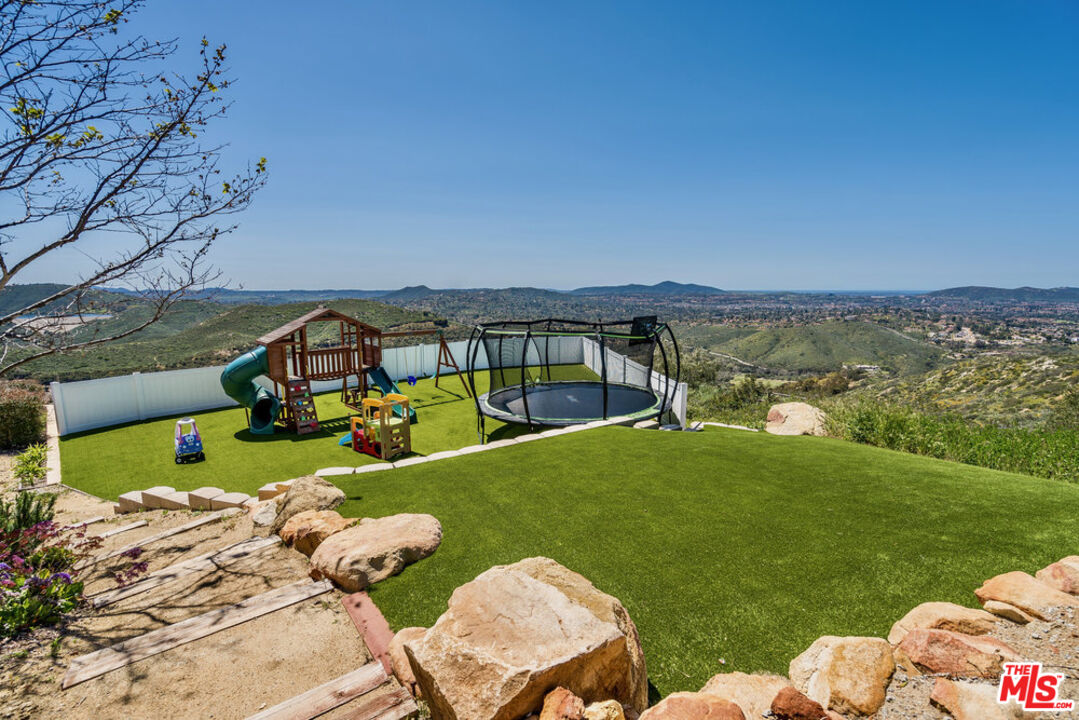18000 Sunset Point Road Poway, CA 92064 - Photo 39 of 43 a view of a table and chairs near an ocean