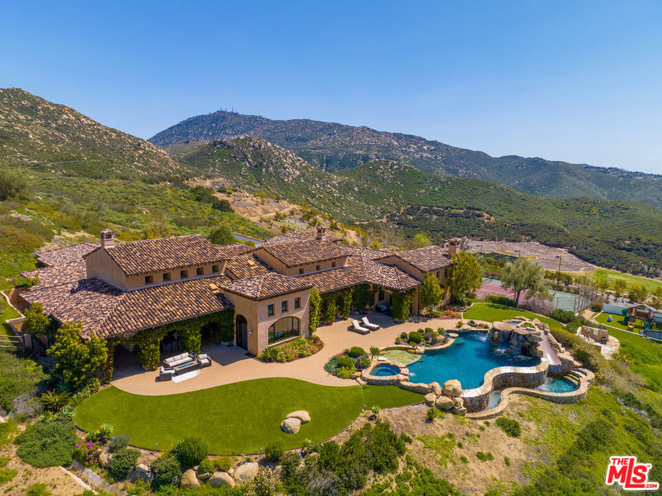18000 Sunset Point Road Poway, CA 92064 - Photo 40 of 43 a view of a patio with chairs and table with chairs