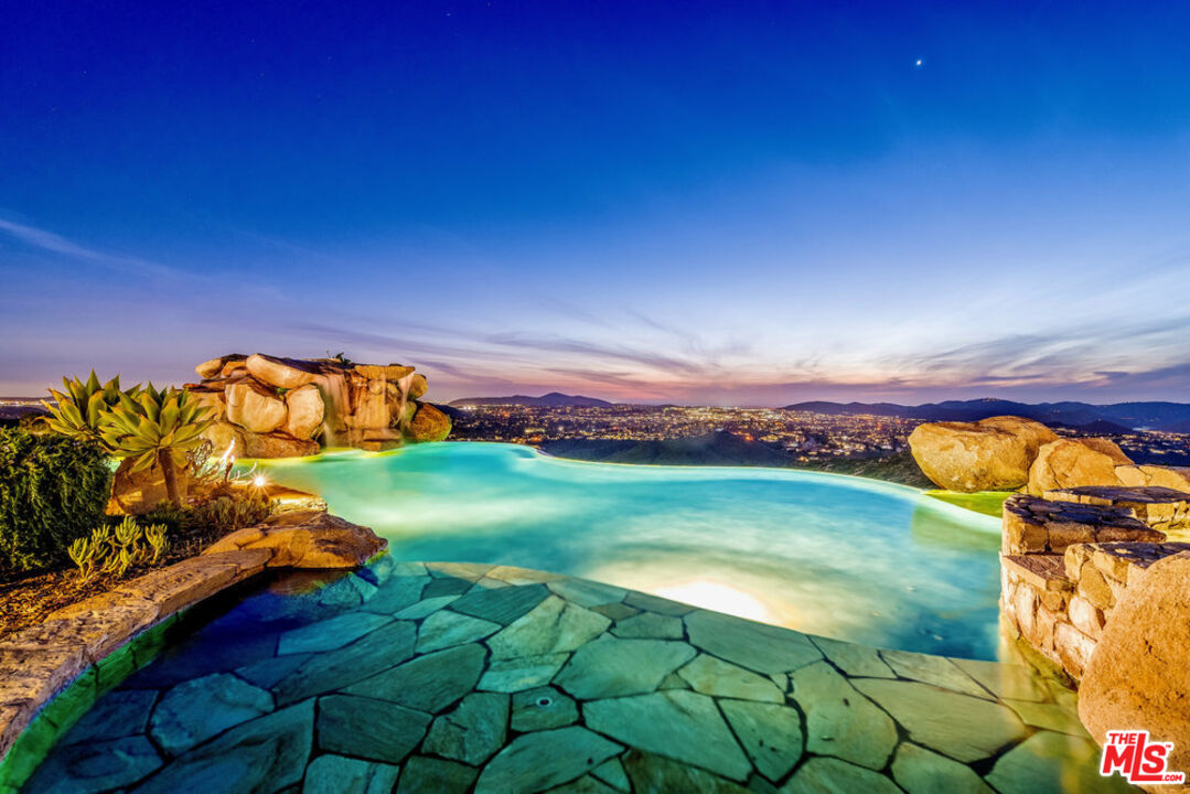 18000 Sunset Point Road Poway, CA 92064 - Photo 4 of 43 a view of a golf club with a backyard