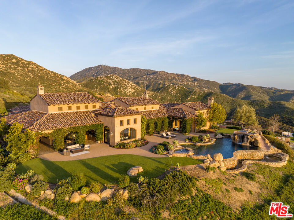 18000 Sunset Point Road Poway, CA 92064 - Photo 42 of 43 a view of a town with mountains in the background