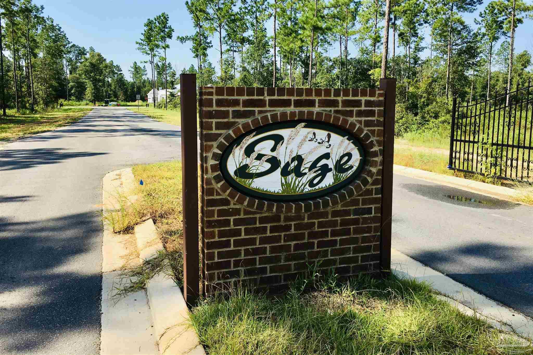 9209 Sage Frst Lane Pace, FL 32571 - Photo 6 of 26 a view of a garden with a pathway