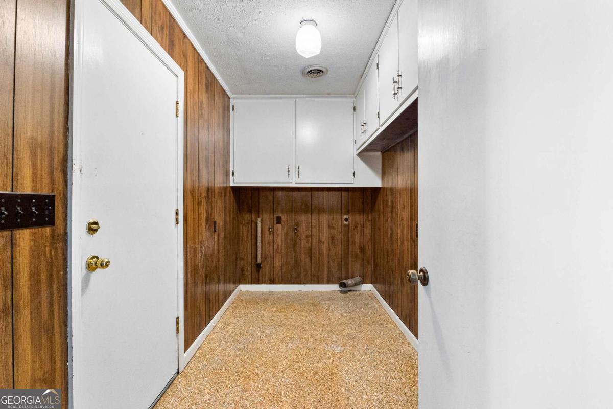 2540 Hannahs Mill Road Thomaston, GA 30286 - Photo 15 of 76 a view of a hallway with wooden floor and staircase