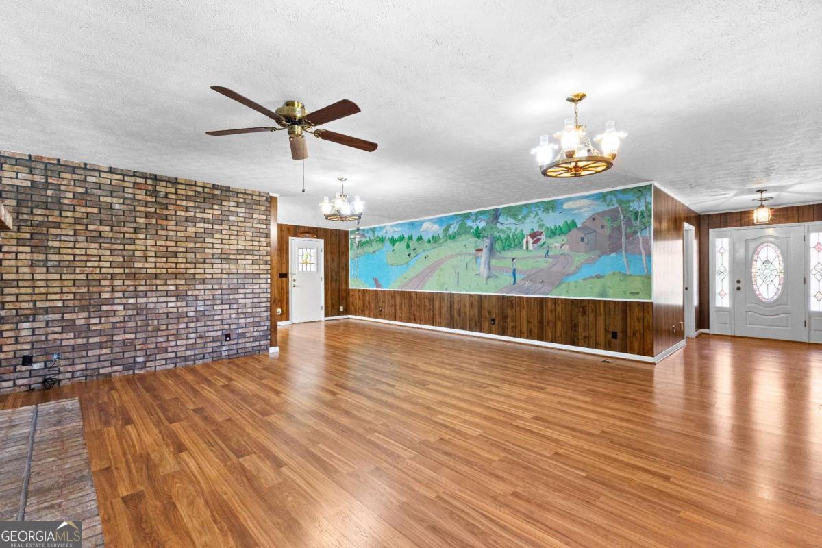 2540 Hannahs Mill Road Thomaston, GA 30286 - Photo 17 of 76 a view of empty room with wooden floor and fan