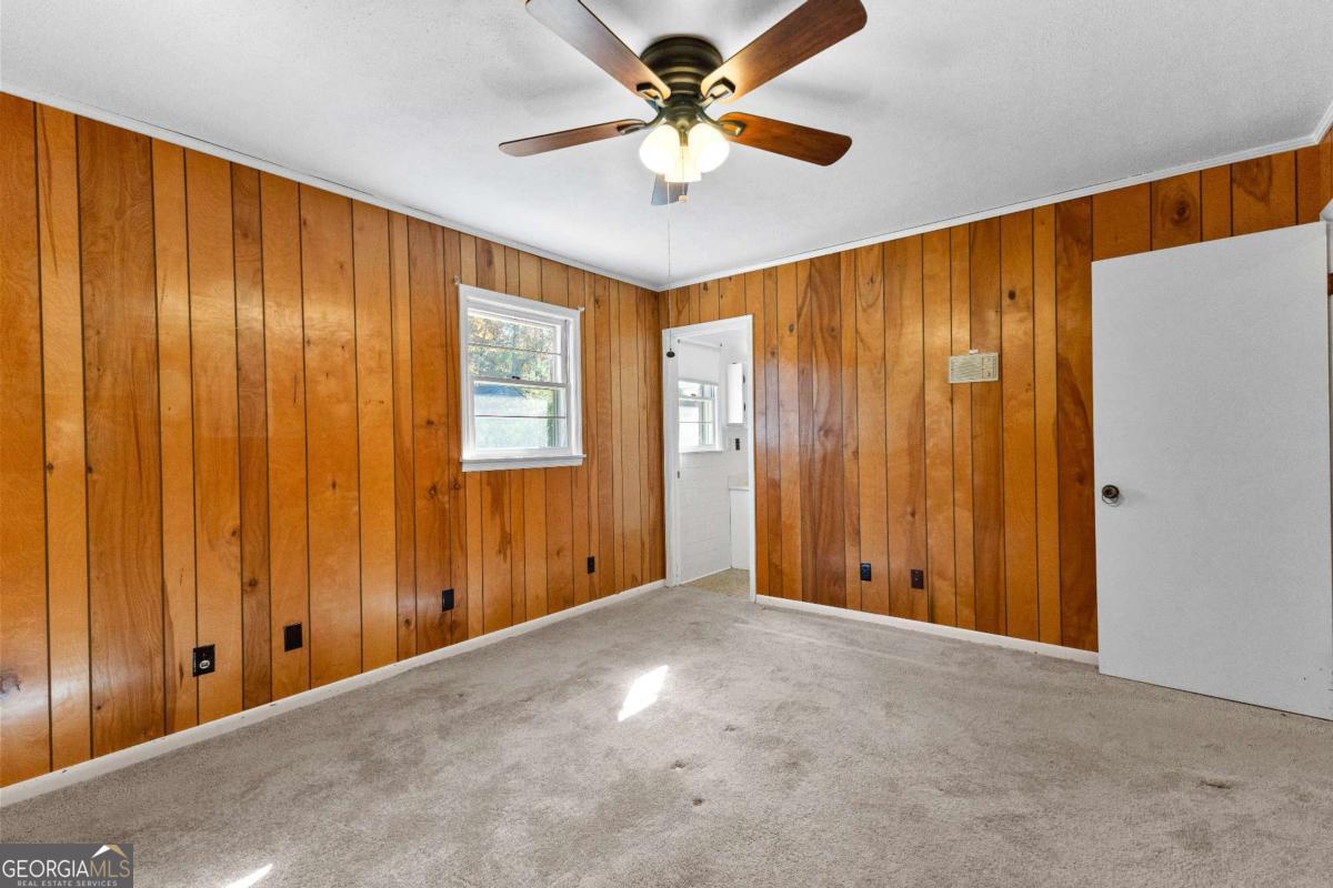 2540 Hannahs Mill Road Thomaston, GA 30286 - Photo 27 of 76 an empty room with windows and fan
