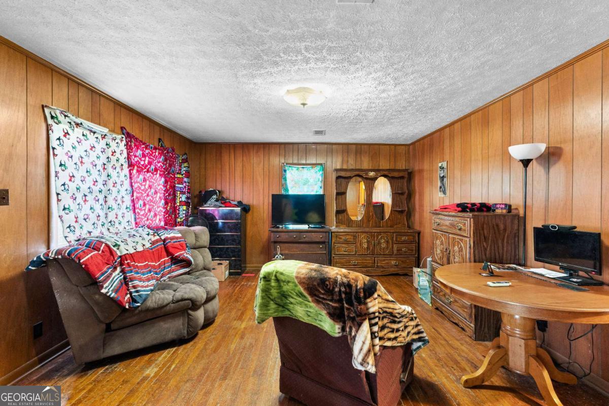 2540 Hannahs Mill Road Thomaston, GA 30286 - Photo 62 of 76 a living room with furniture and a flat screen tv